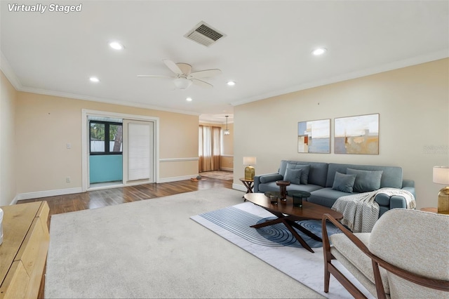 1515 12th Ct SE Unit 55, Largo, FL 33771 - living area with ornamental molding, wood finished floors, recessed lighting, baseboards, and a ceiling fan