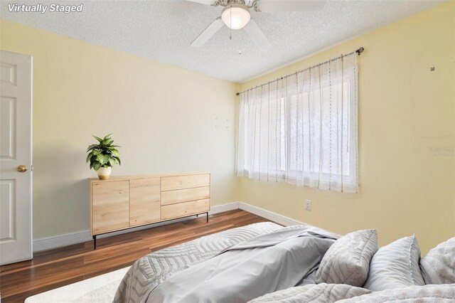 1515 12th Ct SE Unit 55, Largo, FL 33771 - bedroom featuring dark wood-type flooring and a textured ceiling