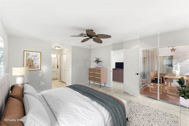 926 SW 37th St, Cape Coral, FL 33914 - bedroom featuring baseboards, ceiling fan, light tile patterned floors, and ensuite bathroom