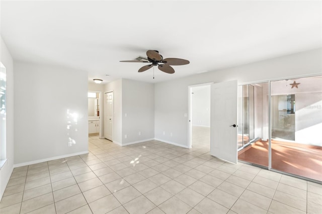 926 SW 37th St, Cape Coral, FL 33914 - unfurnished room with baseboards, ceiling fan, and light tile patterned flooring