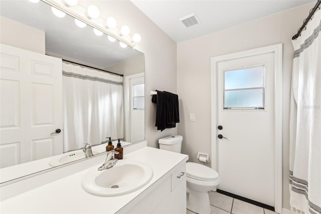 926 SW 37th St, Cape Coral, FL 33914 - full bathroom featuring toilet, visible vents, tile patterned flooring, and vanity