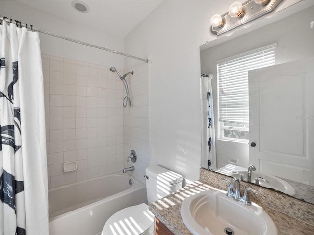 full bathroom featuring vanity, shower / tub combo with curtain, and toilet
