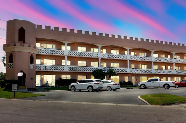 2457 Ecuadorian Way Unit 63, Clearwater, FL 33763 - property at dusk with uncovered parking
