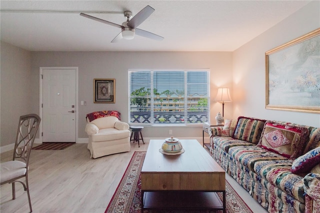 2457 Ecuadorian Way Unit 63, Clearwater, FL 33763 - living room featuring baseboards, a ceiling fan, and wood finished floors