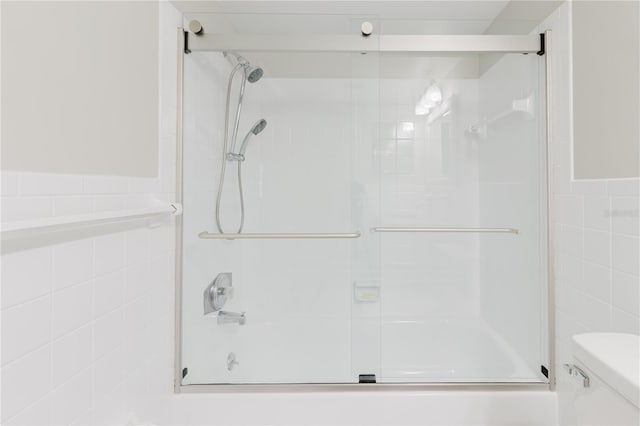 2457 Ecuadorian Way Unit 63, Clearwater, FL 33763 - bathroom featuring tile walls and toilet