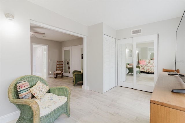 2457 Ecuadorian Way Unit 63, Clearwater, FL 33763 - sitting room featuring light wood-type flooring, baseboards, and visible vents