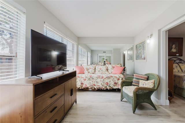 2457 Ecuadorian Way Unit 63, Clearwater, FL 33763 - bedroom with baseboards and light wood-style flooring