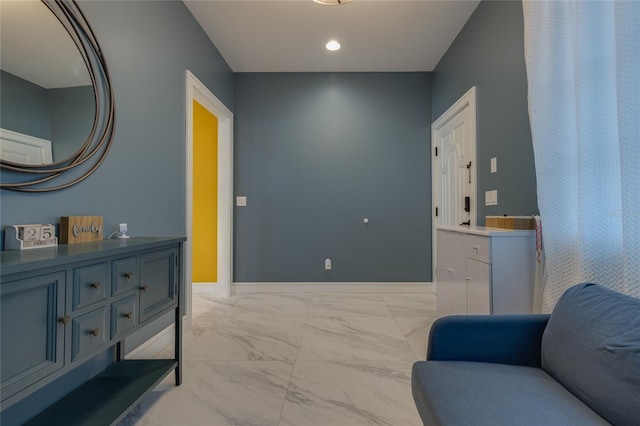 sitting room with marble finish floor