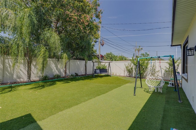 view of yard with a fenced backyard