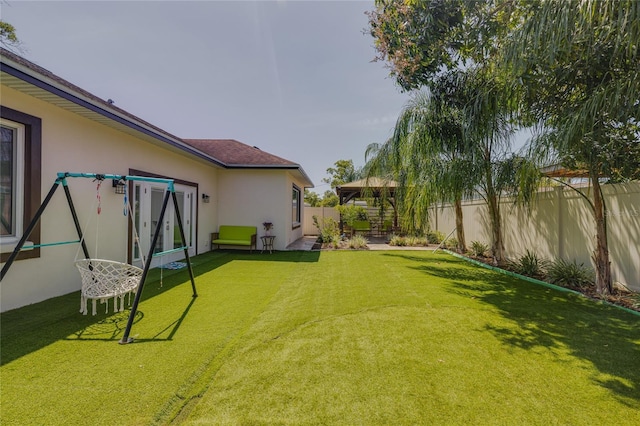 view of yard featuring a gazebo and a fenced backyard