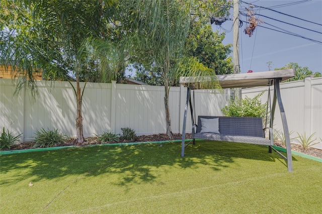 view of yard with a fenced backyard