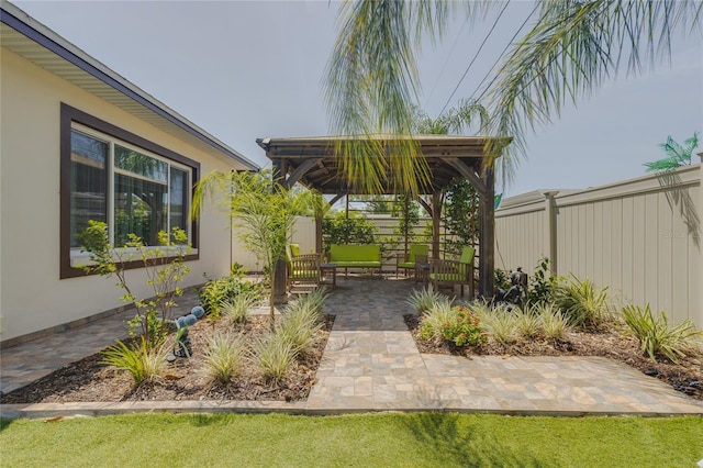 view of yard featuring a gazebo, a patio area, and fence