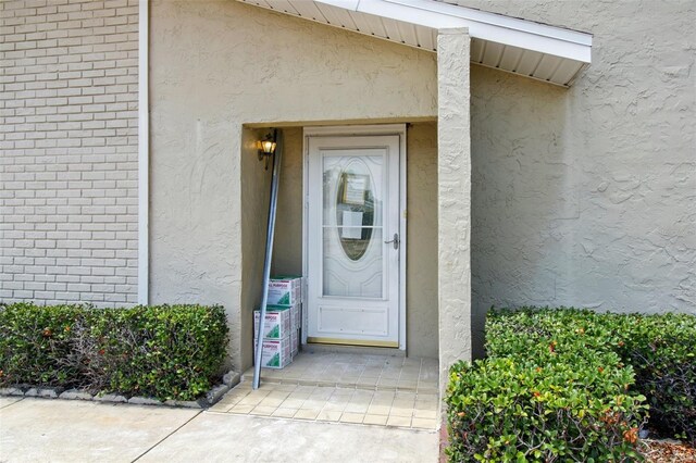 1671 Cape Ann Ave NE Unit 4, Saint Petersburg, FL 33702 - property entrance featuring brick siding and stucco siding