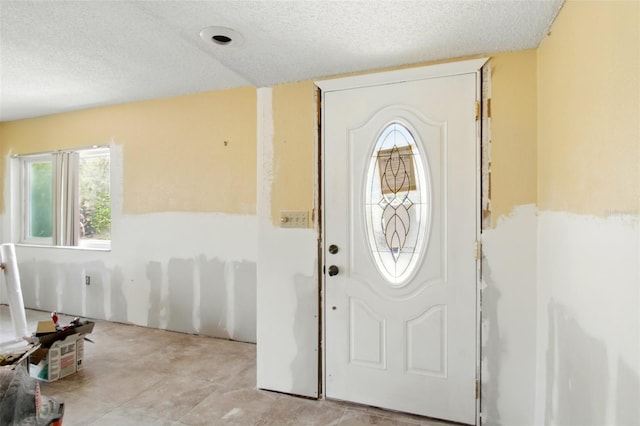 1671 Cape Ann Ave NE Unit 4, Saint Petersburg, FL 33702 - foyer entrance featuring a textured ceiling
