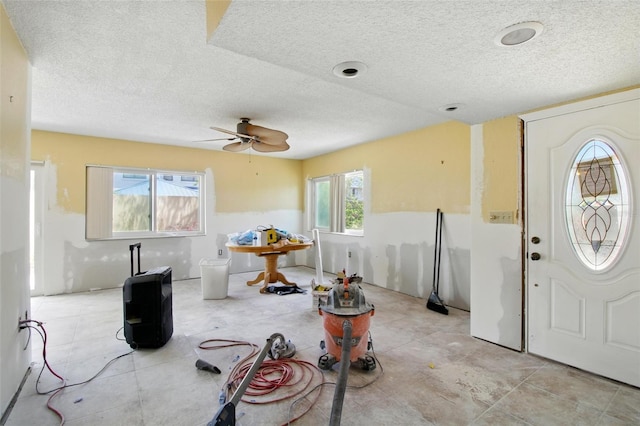 1671 Cape Ann Ave NE Unit 4, Saint Petersburg, FL 33702 - entryway featuring a ceiling fan and a textured ceiling