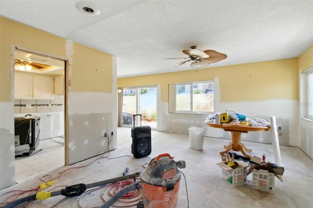 1671 Cape Ann Ave NE Unit 4, Saint Petersburg, FL 33702 - living room with a ceiling fan and a textured ceiling