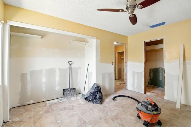 1671 Cape Ann Ave NE Unit 4, Saint Petersburg, FL 33702 - unfurnished bedroom featuring a textured ceiling and a ceiling fan