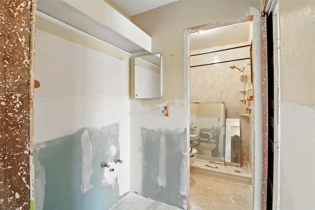 1671 Cape Ann Ave NE Unit 4, Saint Petersburg, FL 33702 - bathroom with a stall shower, toilet, and tile patterned flooring