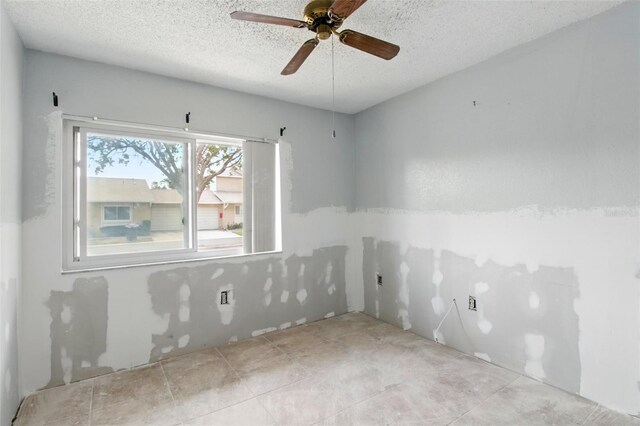 1671 Cape Ann Ave NE Unit 4, Saint Petersburg, FL 33702 - unfurnished room with ceiling fan and a textured ceiling