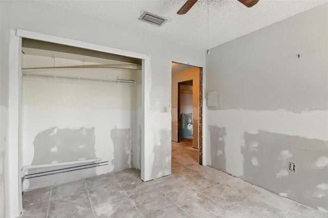 1671 Cape Ann Ave NE Unit 4, Saint Petersburg, FL 33702 - unfurnished bedroom featuring tile patterned flooring, a closet, visible vents, a ceiling fan, and a textured ceiling