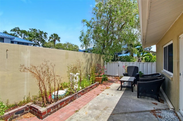 1671 Cape Ann Ave NE Unit 4, Saint Petersburg, FL 33702 - view of patio / terrace with a fenced backyard