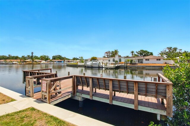 1671 Cape Ann Ave NE Unit 4, Saint Petersburg, FL 33702 - dock area featuring a residential view and a water view