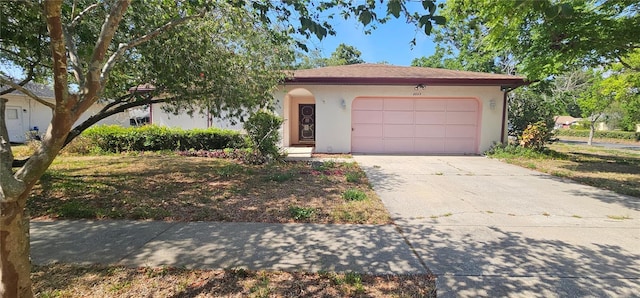 8623 Stonehedge Way, Hudson, FL 34667 - ranch-style home with an attached garage, driveway, and stucco siding