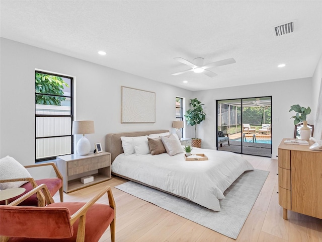 bedroom featuring visible vents, recessed lighting, light wood finished floors, and access to outside