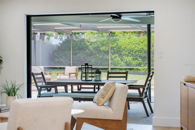 dining area with baseboards, ceiling fan, and wood finished floors