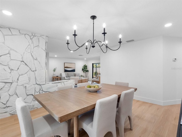 dining area featuring a notable chandelier, recessed lighting, light wood-style flooring, and visible vents