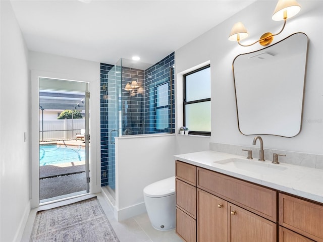 full bathroom with vanity, toilet, plenty of natural light, and a stall shower