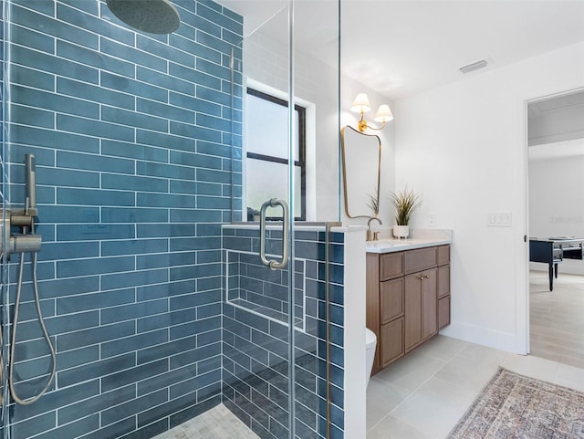 full bath featuring vanity, tile patterned flooring, a stall shower, and visible vents