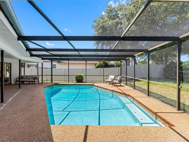 view of pool with a fenced backyard, a fenced in pool, a lanai, and a patio