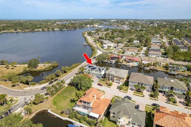 birds eye view of property with a residential view and a water view