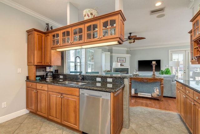 kitchen with light tile patterned floors, ceiling fan, stainless steel dishwasher, and a sink