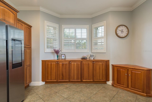 kitchen with smart refrigerator, crown molding, and brown cabinets