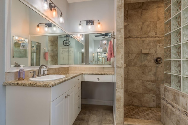 full bathroom with tile patterned floors, ceiling fan, walk in shower, and vanity