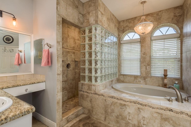 bathroom featuring a walk in shower, vanity, and a bath