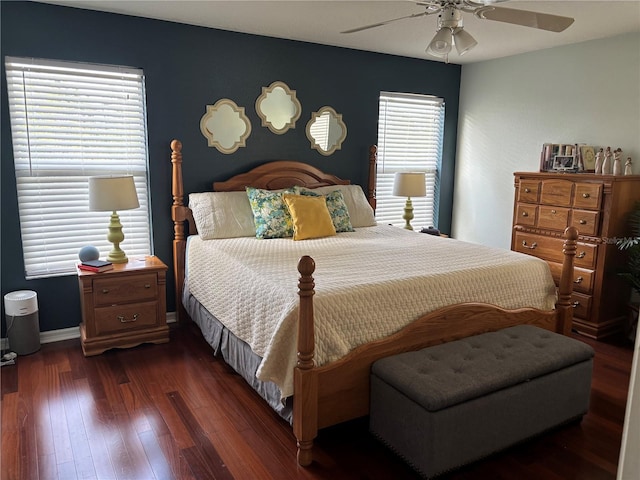 bedroom featuring baseboards, ceiling fan, and wood finished floors