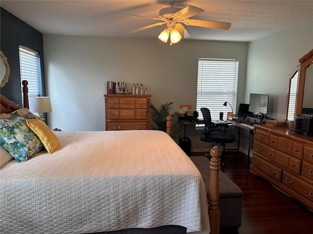 bedroom with dark wood-style flooring and a ceiling fan