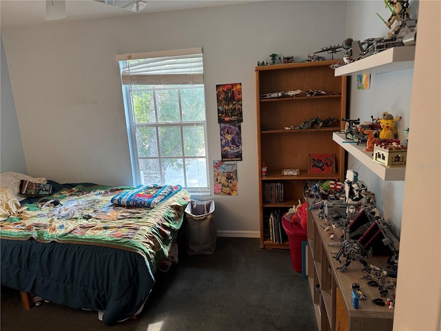 bedroom with baseboards and carpet flooring