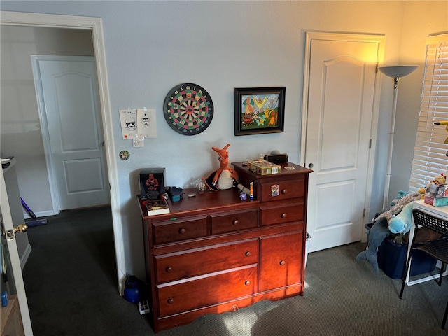 bedroom featuring dark colored carpet
