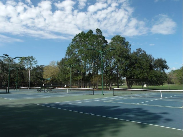 view of sport court with fence