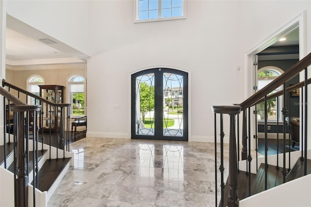 2604 S Bryant Cir, Tampa, FL 33629 - foyer entrance featuring stairway, french doors, baseboards, a towering ceiling, and ornamental molding