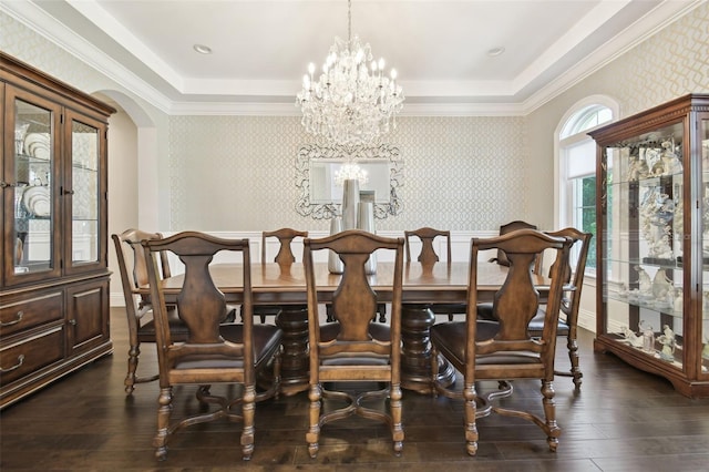 2604 S Bryant Cir, Tampa, FL 33629 - dining space with dark wood-style flooring, a raised ceiling, wallpapered walls, a chandelier, and arched walkways