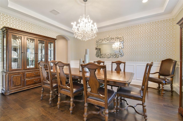 2604 S Bryant Cir, Tampa, FL 33629 - dining area with wallpapered walls, arched walkways, a raised ceiling, dark wood-style floors, and a chandelier