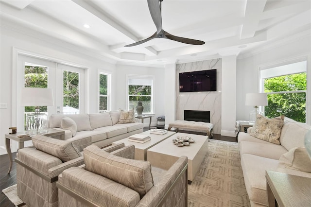 2604 S Bryant Cir, Tampa, FL 33629 - living room with coffered ceiling, plenty of natural light, ceiling fan, a high end fireplace, and beam ceiling
