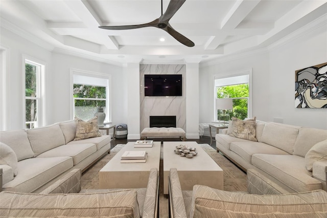 2604 S Bryant Cir, Tampa, FL 33629 - living area featuring coffered ceiling, a ceiling fan, plenty of natural light, beamed ceiling, and a high end fireplace