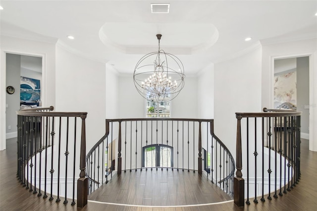 2604 S Bryant Cir, Tampa, FL 33629 - staircase with a chandelier, wood finished floors, a tray ceiling, crown molding, and recessed lighting