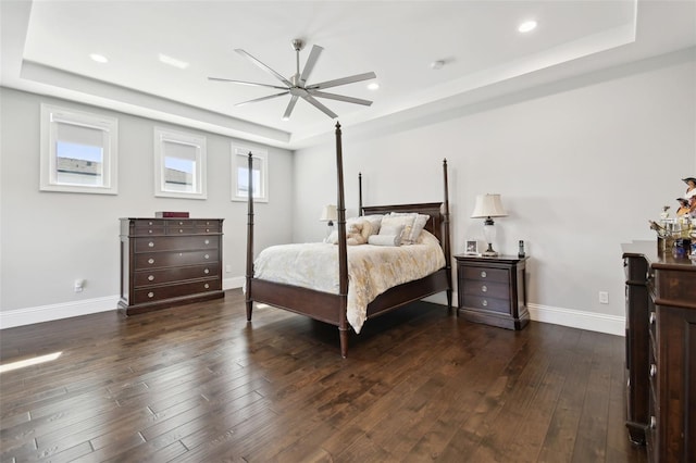 2604 S Bryant Cir, Tampa, FL 33629 - bedroom featuring a tray ceiling, hardwood / wood-style flooring, baseboards, recessed lighting, and a ceiling fan